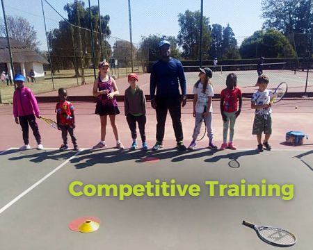 Tennis coach with children in Harare. Junior squads.
